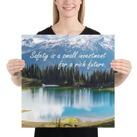 A workplace safety poster depicting a beautiful pond in the foreground, lush evergreens in the middle ground and snow-capped mountains in the background with text saying safety is a small investment for a rich future.