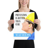 A safety poster showing a close-up of a worker wearing safety glasses, a hard hat, and earplugs with the slogan prevention is better than cure, wear your PPE.