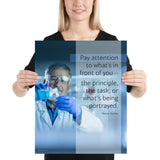 Safety poster showing an older man wearing a white lab coat, gloves, and safety glasses, working in a laboratory with a safety quote to his left.