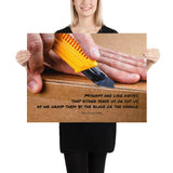 A workplace safety poster showing a close-up of hands opening a box using a boxcutter with a safety quote below the hands.