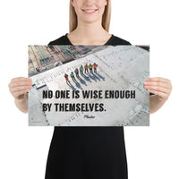 A workplace safety poster showing an aerial view of construction workers in reflective vests standing in a line on top of a building with their shadows being cast on the building with the quote no one is wise enough by themselves by Plautus.