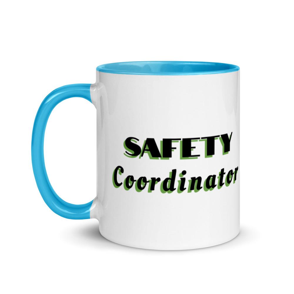 White ceramic mug with "Safety Coordinator" in bold text across the side, with blue color on the inside, the rim, and the handle.