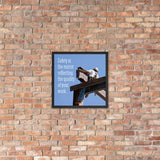 A workplace safety poster showing a construction ironworker on steel beams in a hardhat and safety harness with a bright blue sky in the background with the slogan safety is the mirror reflecting the quality of your work.