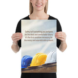 A workplace safety poster showing 3 multi colored hardhats sitting on a wall with the slogan safety isn't something you postpone for the ideal and comfortable future. It's the first condition necessary for the messy and unpredictable present.