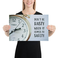 A workplace safety poster showing a close-up of a clock face with the slogan don't be hasty when it comes to safety.