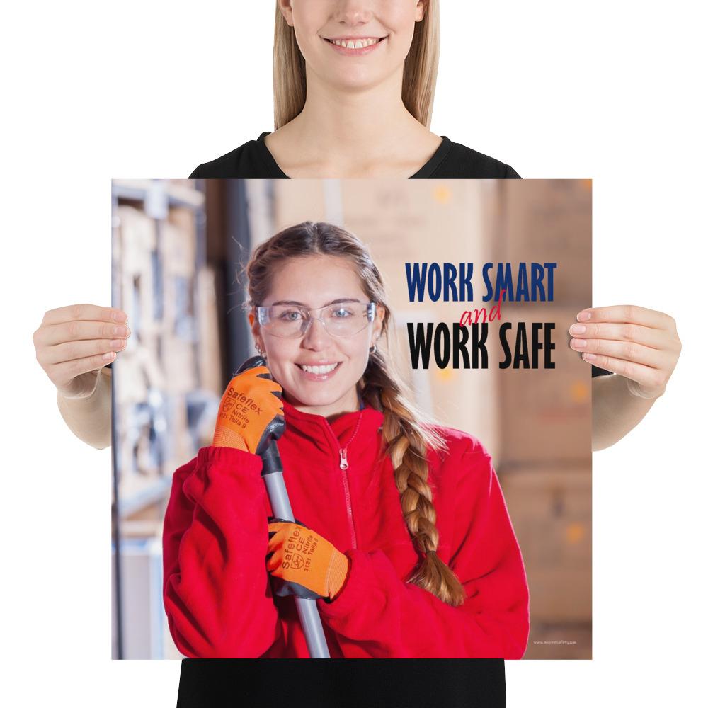 A workplace safety poster showing a warehouse worker wearing gloves and safety glasses and holding a broom and smiling with the slogan work smart and work safe.