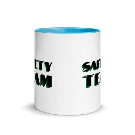 White ceramic mug with "Safety Team" in bold text across the side, with blue color on the inside, the rim, and the handle.