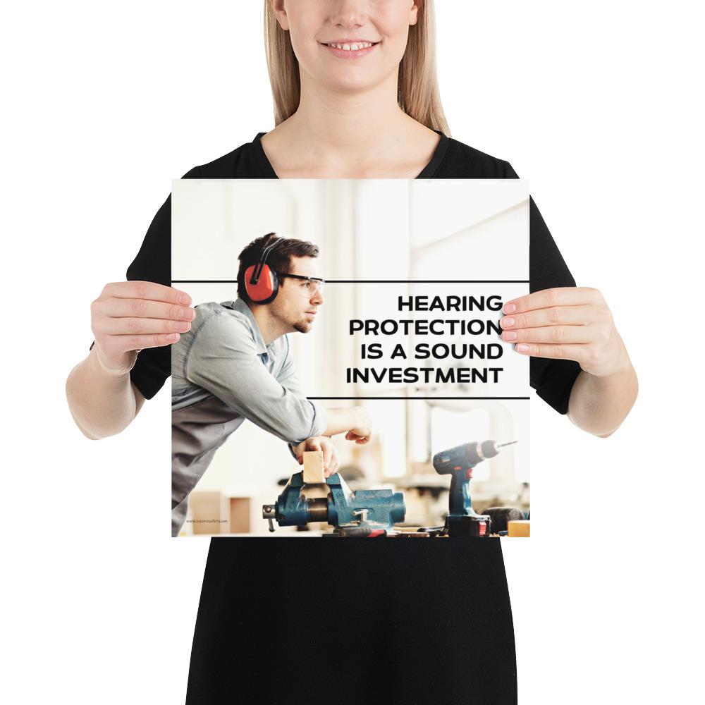 A workplace safety poster of a man in safety glasses and earmuffs taking a break in his woodshop with a safety slogan to the right.
