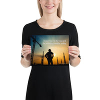 A safety poster showing a worker on a construction site being silhouetted by a sunset of orange and blue colors with the slogan tomorrow is the reward for working safely today.