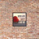 A workplace safety poster depicting a red hard hat sitting on a concrete wall with a dreamy pink sunset in the background with the text never give safety a day off to the right.