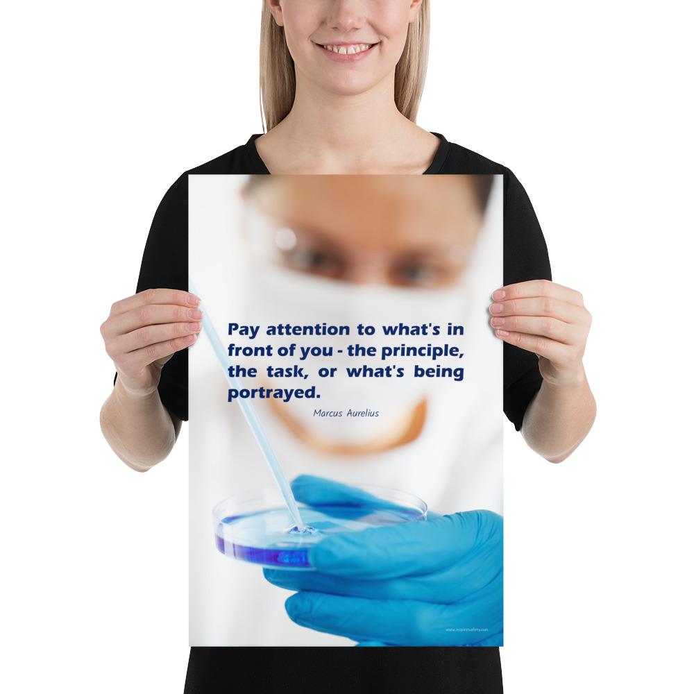 Safety poster showing a close up of a woman's face wearing safety glasses and a white face mask, holding a petri dish and pipette with a safety quote written in blue text.