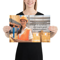 Safety poster showing a female warehouse worker smiling and wearing an orange reflective safety vest and orange hard hat with a safety quote written in dark text.