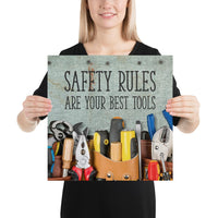 A safety poster showing various tools including screwdrivers, pliers, and wrenches laying on a worktable with the slogan safety rules are your best tools.