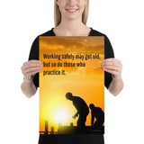 A workplace safety poster showing a construction site and construction workers being silhouetted by a bright and beautiful sunset of different shades of orange with the slogan working safely may get old, but so do those who practice it.