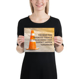 A workplace safety poster showing an orange safety cone with the slogan the near miss reported today is the accident that doesn't happen tomorrow.