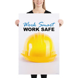 A safety poster showing a close-up of a yellow hard hat on a white background with the slogan work smart and work safe.