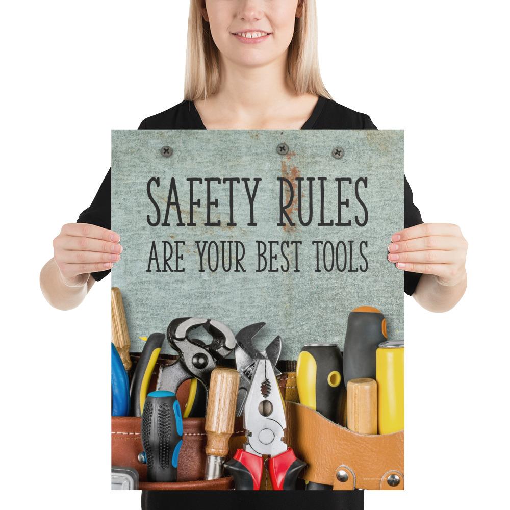 A safety poster showing various tools including screwdrivers, pliers, and wrenches laying on a worktable with the slogan safety rules are your best tools.