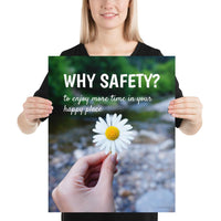 A workplace safety poster showing a close up of a hand holding a bright white daisy in the forest with the slogan why safety? to enjoy more time in your happy place.