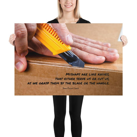A workplace safety poster showing a close-up of hands opening a box using a boxcutter with a safety quote below the hands.