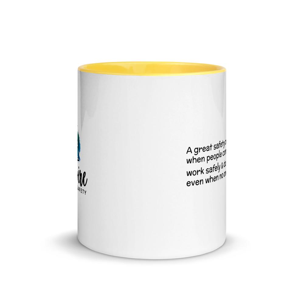 White ceramic mug with the phrase "A great safety culture is when people continue to work safely and do the right thing... even when no one is watching" in a simple black text across the side with the Inspire Safety logo on the other side, with a yellow rim, inside, and handle.