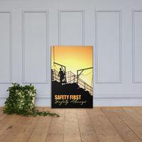 A workplace safety poster showing a construction site and construction workers being silhouetted by a bright and beautiful sunset of different shades of orange with the slogan safety first, safety always.