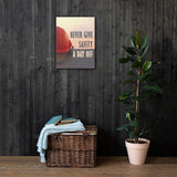 A workplace safety poster depicting a red hard hat sitting on a concrete wall with a dreamy pink sunset in the background with the text never give safety a day off to the right.