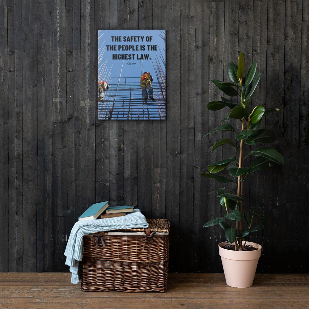 A safety poster showing construction workers scaling rebar with a bright blue sky as the background and a safety quote in black block text.