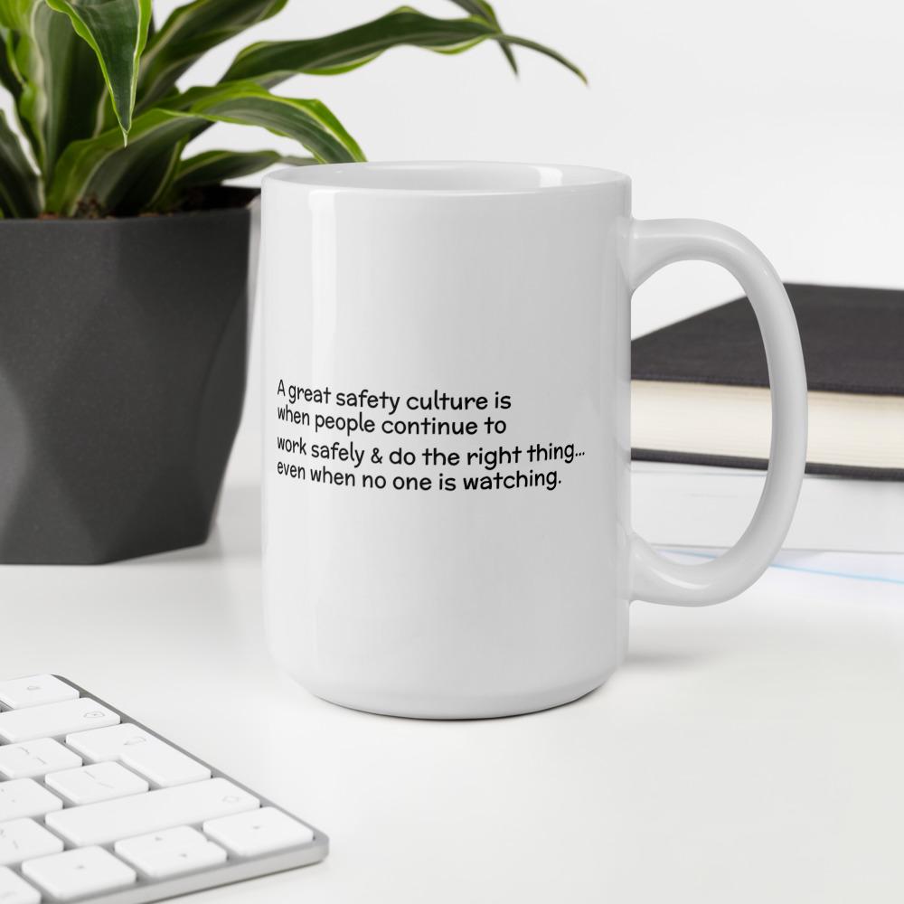 White ceramic mug with the phrase "A great safety culture is when people continue to work safely and do the right thing... even when no one is watching" in a simple black text across the side with the Inspire Safety logo on the other side.