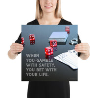 A workplace safety poster of a glossy black table with red dice, playing cards, and poker chips strewn everywhere with a safety slogan in the bottom left corner.