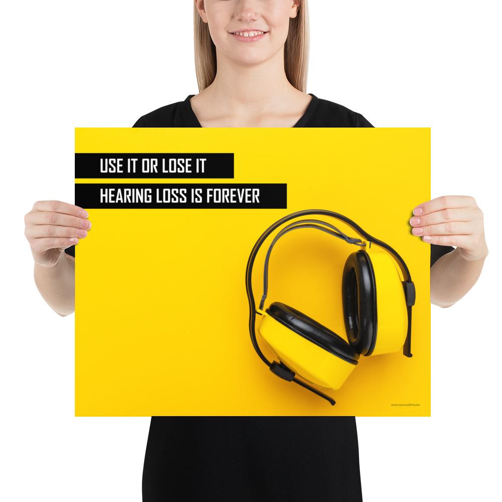 A hearing protection safety poster depicting bright yellow ear muffs on a bright yellow background in the bottom right corner with a bold safety slogan in the upper left corner.