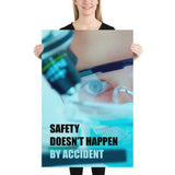 Safety poster of a close up of a woman's eyes wearing safety glasses inspecting a sample on a microscope with safety slogan written at the bottom.