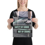 A workplace safety poster showing a close-up of a worker's hands grabbing panes of glass with gloves on with the slogan safety by choice not by chance.