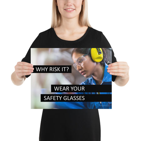 A safety poster showing a close up of a woman working while wearing ear muffs and safety glasses with the slogan "Why Risk It? Wear Your Safety Glasses."