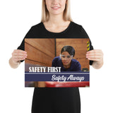 A safety poster showing a woman in safety glasses working in a woodshop with the slogan "Safety first, safety always" below her.
