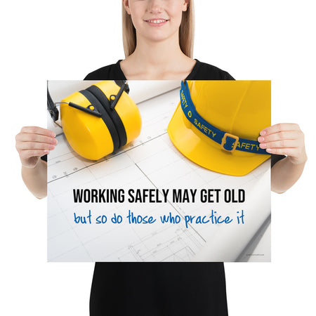A construction safety poster showing yellow ear muffs and a hard hat resting on blueprints with the slogan "Working safely may get old, but so do those who practice it."