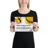 A safety poster showing a yellow hard hat and yellow ear muffs on blueprints with a safety quote by Johann Wolfgang von Goethe that says "Knowing is not enough, we must apply. Willing is not enough, we must do."