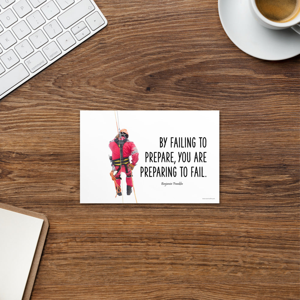 A safety print showing a person in full fall protection gear with a quote by Ben Franklin that says "By failing to prepare, you are preparing to fail."