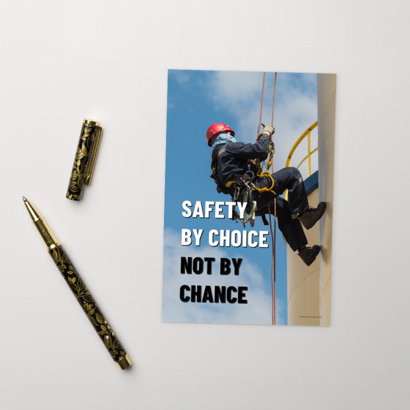A safety mini print of a fully harnessed man wearing a hard hat scaling the side of a building with a bright blue sky and clouds in the background with the text safety by choice, not by chance in bold text to his left.