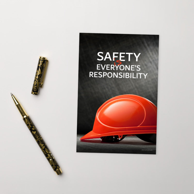 A safety mini print showing a red hard hat in front of a grey, industrial-looking background with the slogan safety is everyone's responsibility.