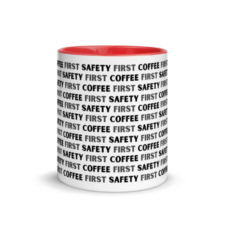 White ceramic mug with black repeating text that says "Safety First, Coffee First" with a red rim, inside, and handle.
