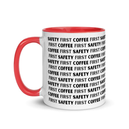 White ceramic mug with black repeating text that says "Safety First, Coffee First" with a red rim, inside, and handle.