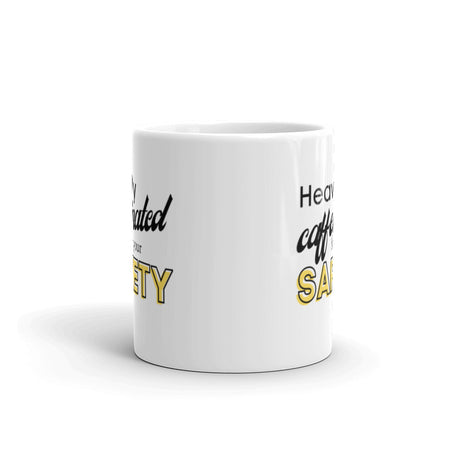 White ceramic mug with the phrase "Heavily caffeinated for your safety."
